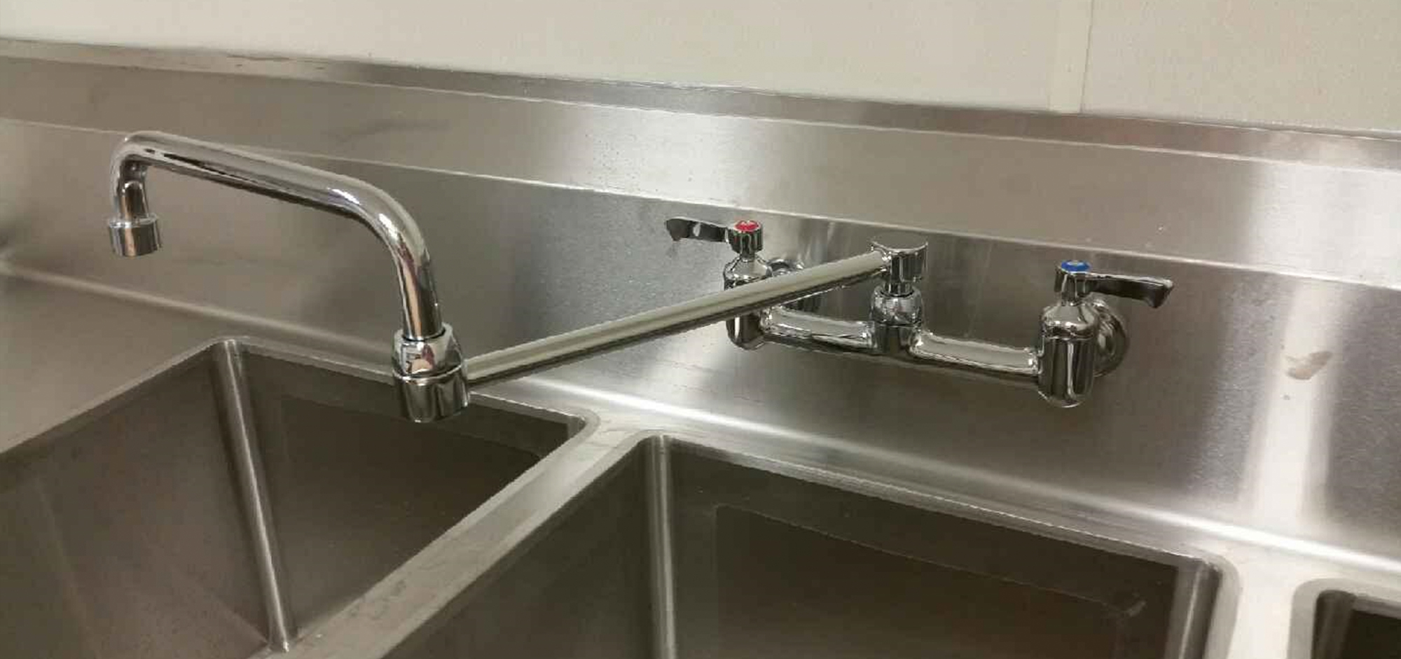 Kitchen sink and faucet plumbing by Merritt Plumbing & Heating